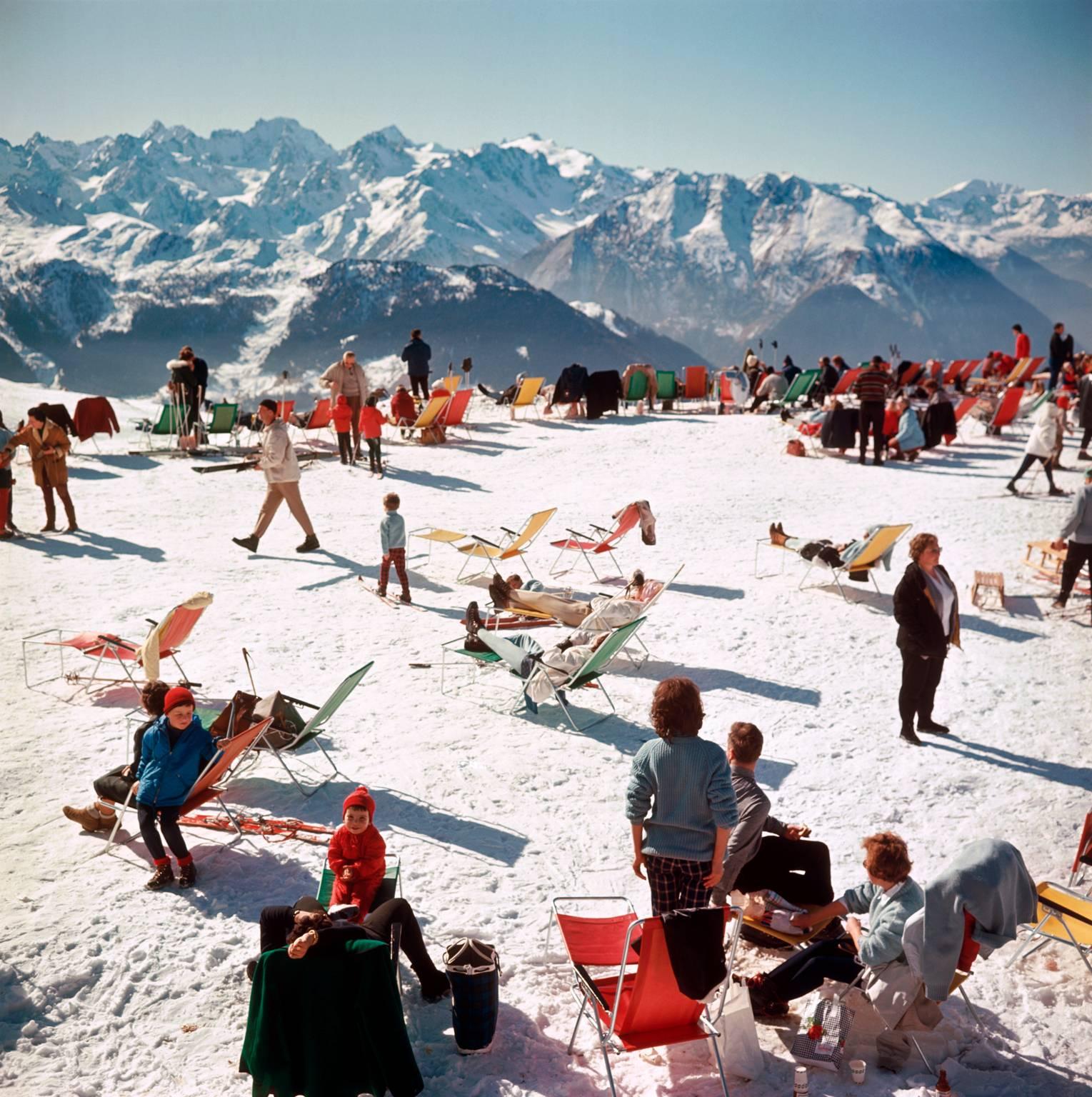 'Verbier Vacation' by Slim Aarons

Skiiers soak up the sun in Verbier, 1964.

Typically 'Slim' this photograph epitomises elegant travel and the vintage style and glamour of the period's wealthy and famous, beautifully documented by Aarons.

In his