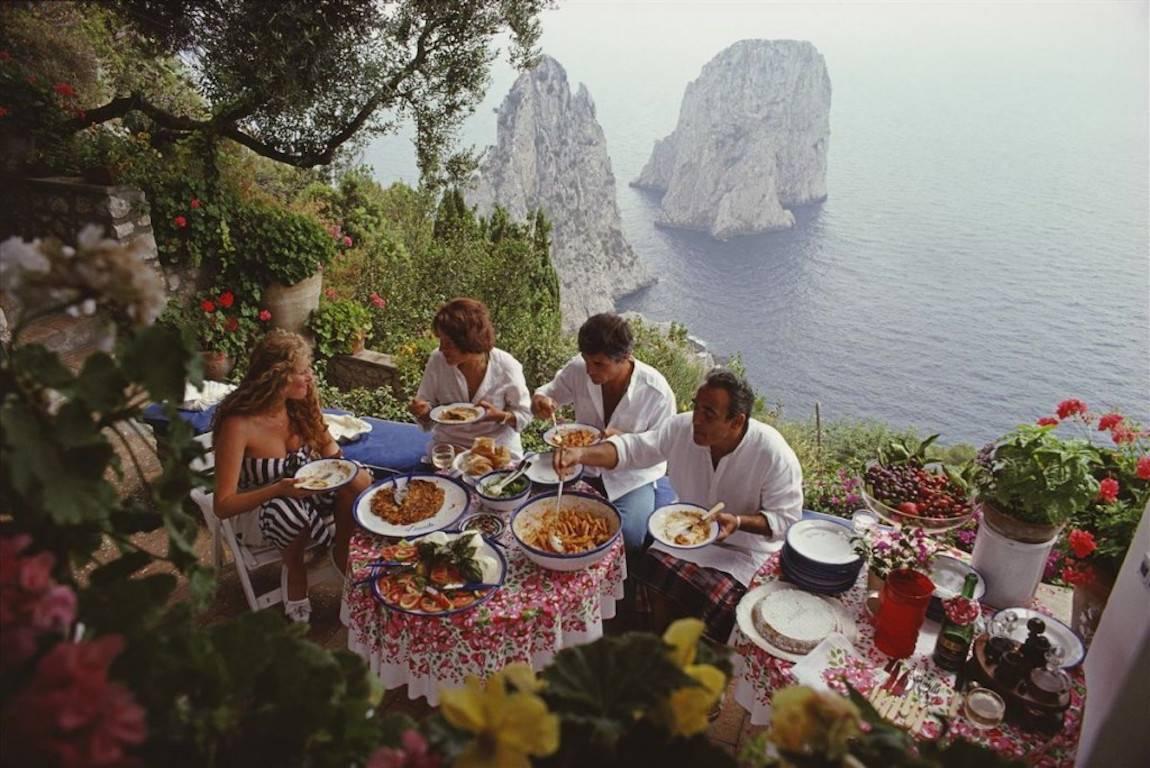 Slim Aarons Figurative Photograph - 'Dining Al Fresco On Capri'  (Estate Stamped Edition)