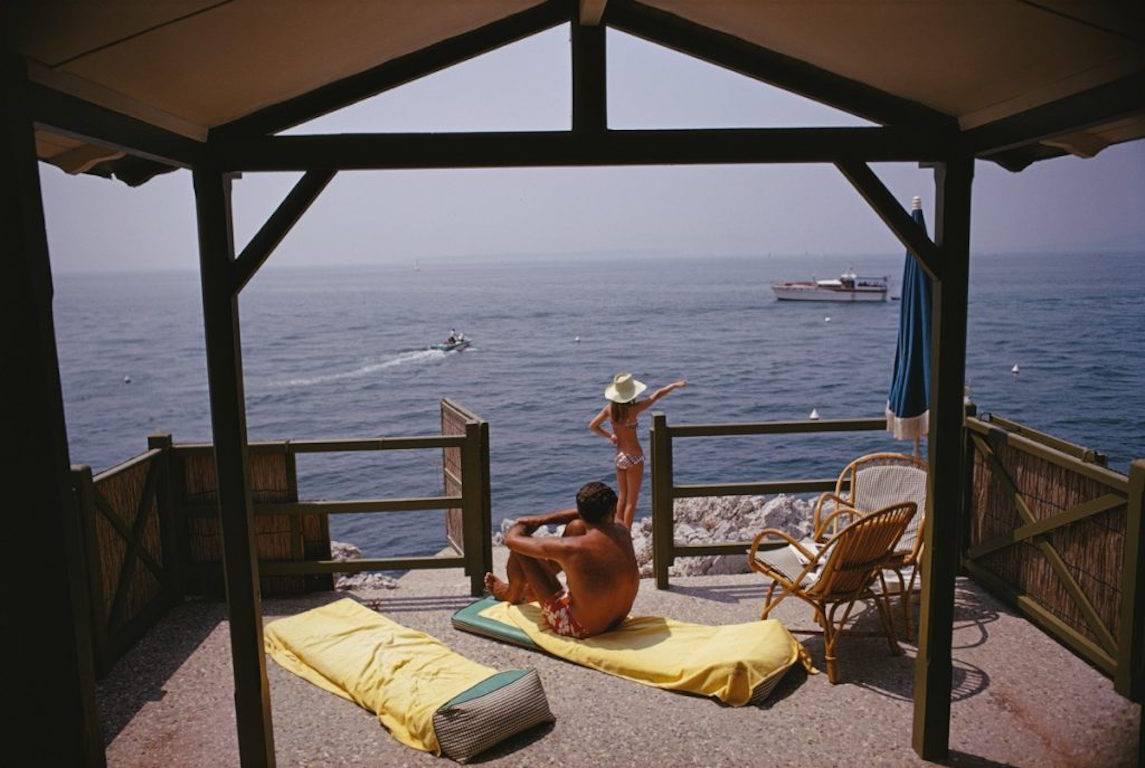 Slim Aarons Figurative Photograph - 'Beach Hut In Antibes'  (Estate Stamped Edition)