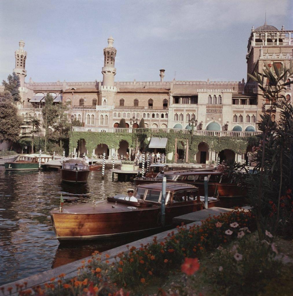 Slim Aarons Landscape Photograph - 'Boats Before The Excelsior' Venice (Estate Stamped Edition)