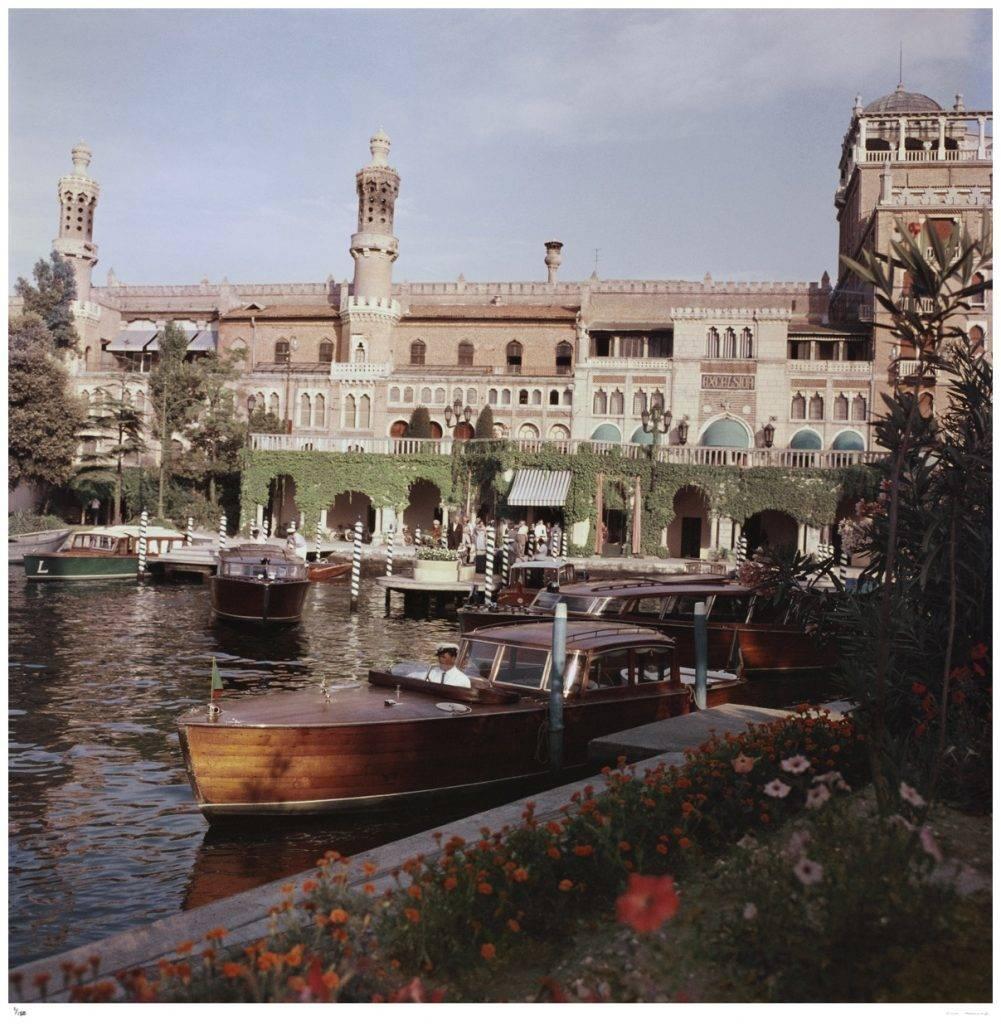 'Boats Before The Excelsior' Venice (Estate Stamped Edition) - Photograph by Slim Aarons