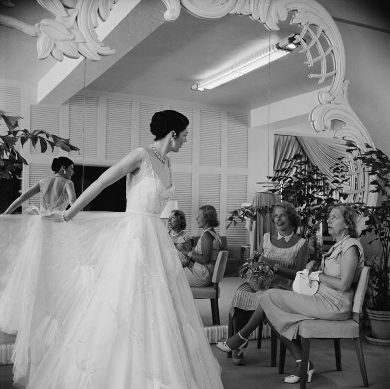 'Exclusive Fashions' by Slim Aarons 

Mrs T.R. Potter and Mrs Edward Magnus (right) in the Saks of 5th Avenue dress shop, Worth Avenue, Palm Beach, Florida, circa 1955. 

This photograph epitomises the travel style and glamour of the period's