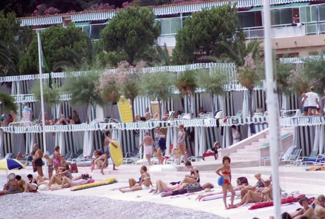 Slim Aarons Color Photograph - 'Monte Carlo Beach' 1966 (Estate Stamped Edition)