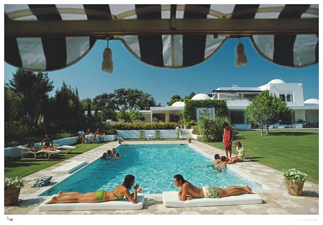 'Poolside In Sotogrande' (Estate Stamped Edition) - Photograph by Slim Aarons