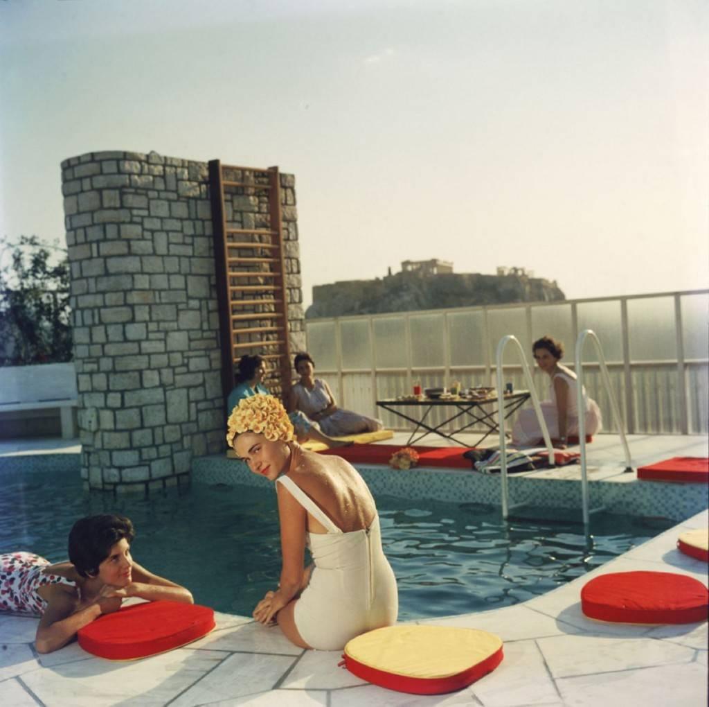 'Penthouse Pool'  by Slim Aarons

Young women by the Canellopoulos penthouse pool, Athens, July 1961.

Typically 'Slim' and almost as well known as 'Poolside Gossip' , this photograph epitomises the vintage style and glamour of the period's wealthy