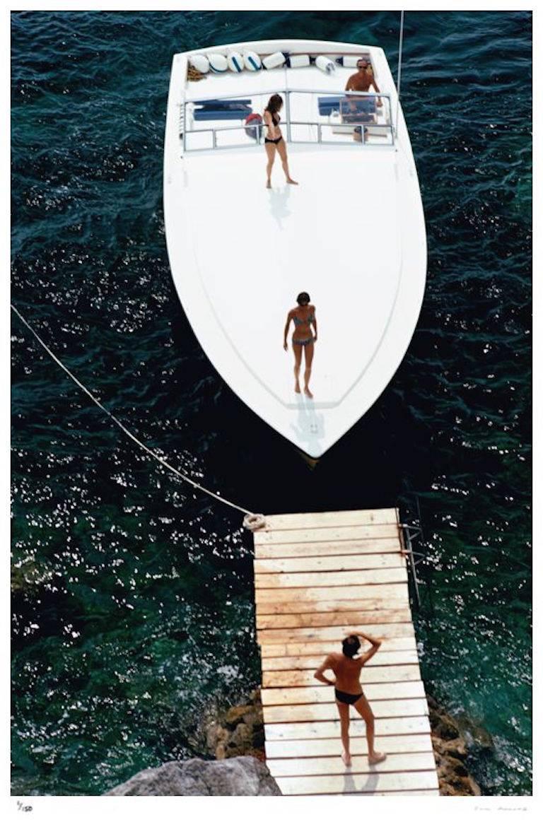 'Speedboat Landing' Italy  (Estate Stamped Edition) - Photograph by Slim Aarons