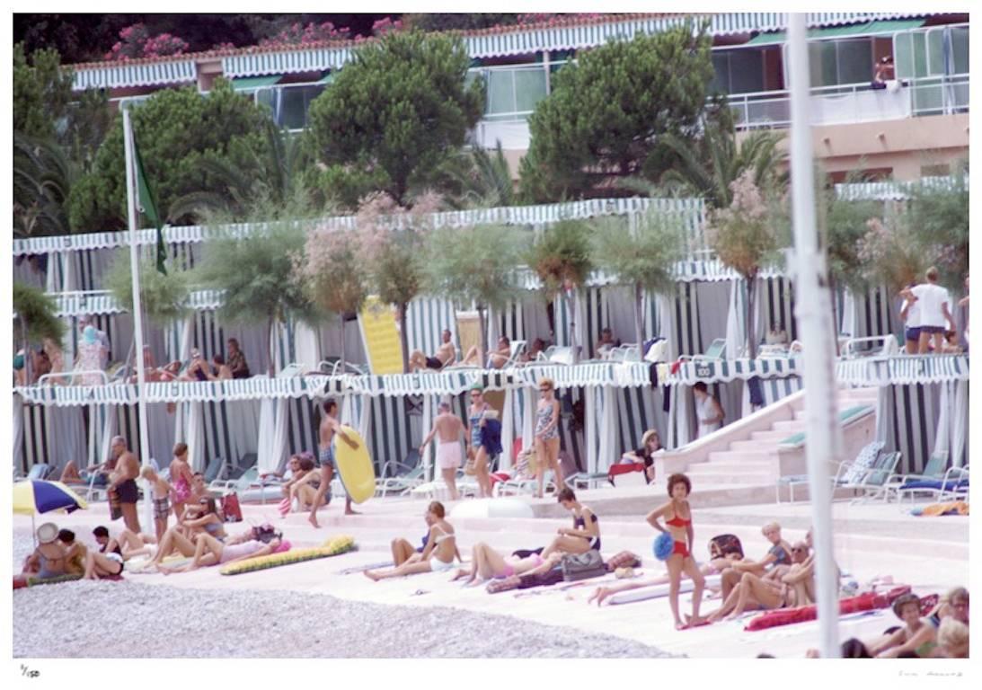 'Monte Carlo Beach' 1966 (Estate Stamped Edition) - Photograph by Slim Aarons