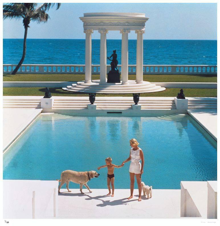 'Nice Pool' by Slim Aarons

American writer C.Z. Guest (Mrs F.C. Winston Guest, 1920 - 2003) and her son Alexander Michael Douglas Dudley Guest in front of their Grecian temple pool on the ocean-front estate, Villa Artemis, Palm Beach, 1965.

The