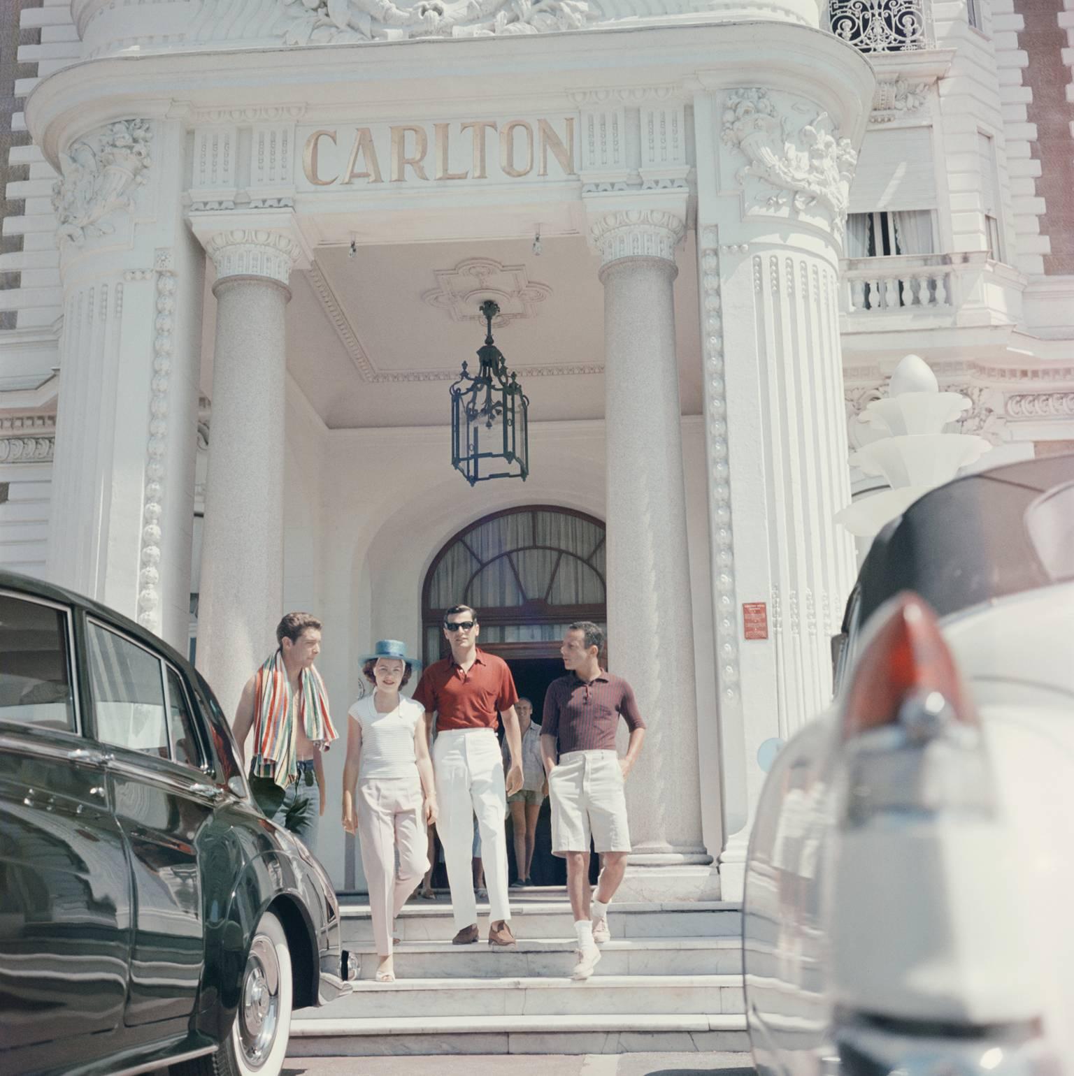 'Staying At The Carlton' by Slim Aarons

Guests at the entrance to the Carlton Hotel, Cannes, France, 1958.

This photograph epitomises the travel style and glamour of the period's wealthy and famous, beautifully documented by Aarons.

In his words,