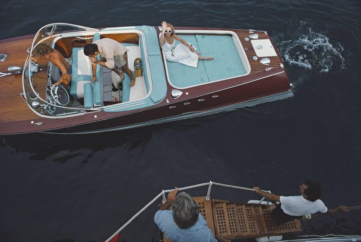 'Montecarlo'  by Slim Aarons

A beautiful and classic Slim Aarons C-type photograph, limited edition to 150 only, 

numbered and stamped by The Slim Aarons Estate on verso.

Supplied with certificate of authenticity.

Friends board a riva boat in
