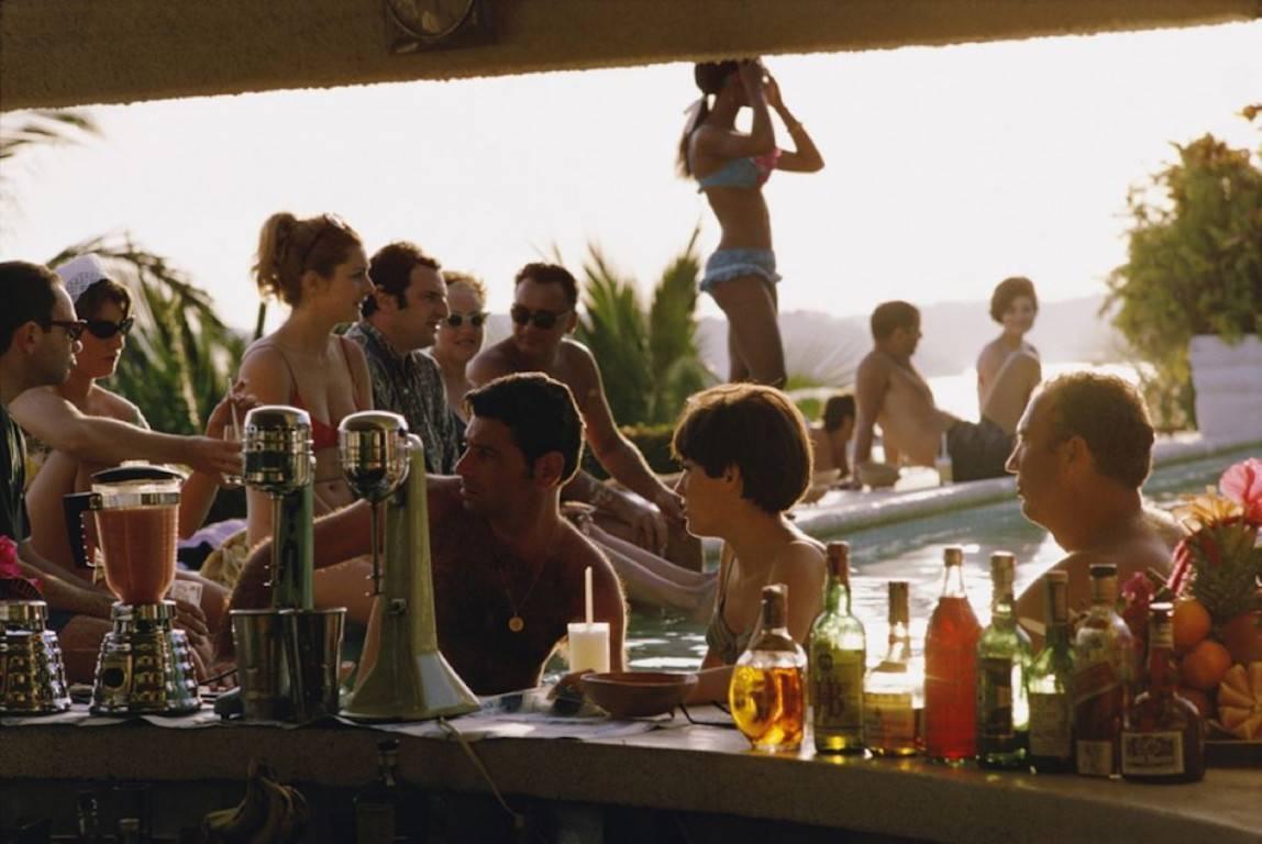 'Vila Vera' by Slim Aarons

The bar at the Villa Vera Hotel Spa and Racquet Club in Acapulco, January 1968.

This photograph epitomises the travel style and glamour of the period's wealthy and famous, beautifully documented by Aarons.

In his words,