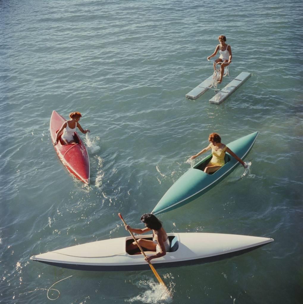 'Lake Tahoe Trip' by Slim Aarons 

Slim Aarons C-type photograph, 
limited edition to 150 only, 
numbered and stamped by The Slim Aarons Estate on verso.
Supplied with certificate of authenticity.


Young women canoeing on the Nevada side of Lake