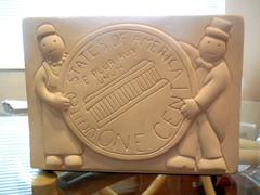 One Cent and Globe Sculpture