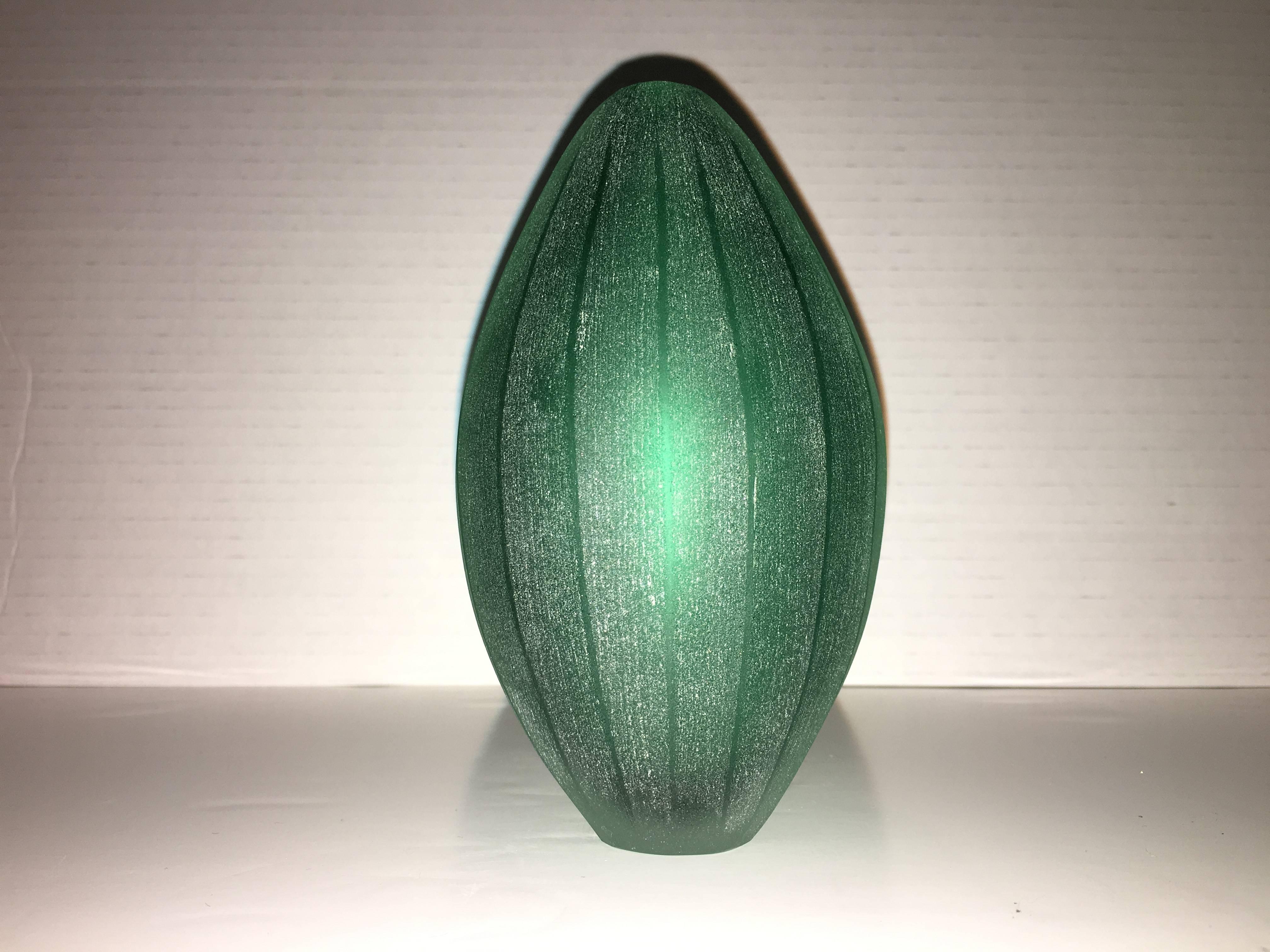 Vase designed by Laura de Santillana in edition for Arcade, 2001. this is from a series of tropical fruit and plant form inspired vases with the same matte, hand engraved, finish:
PAPAIA, made in three different shades of green. MANGO, made in dark