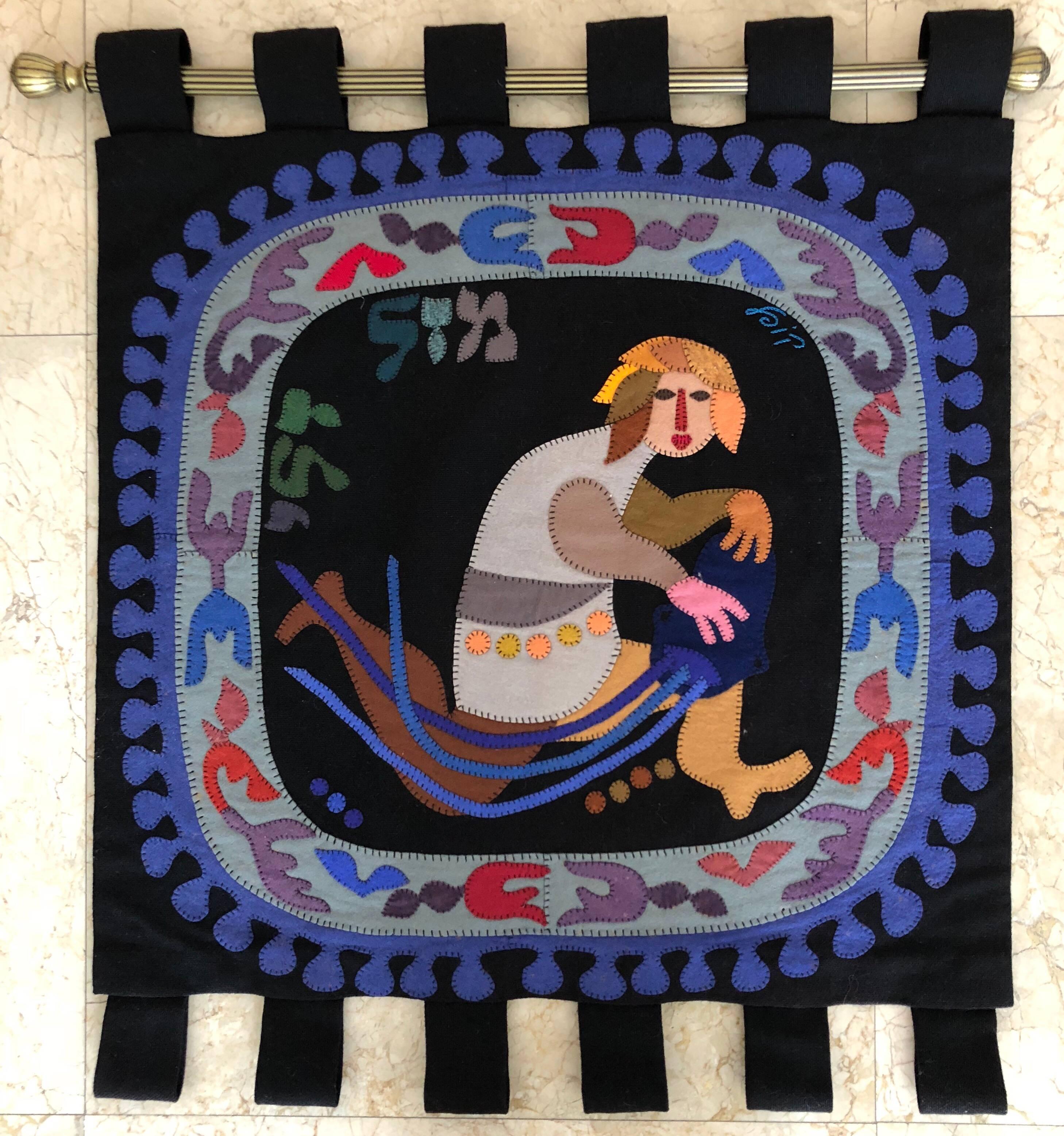 This depicts a Water Carrier, In Hebrew Mazel Deli, (the Zodiac symbol Aquarius) all made by hand. woven and stitched. 


Kopel Gurwin (Hebrew: קופל גורבין‎) (1923–1990) was an Israeli tapestry wall hanging, painter and graphic artist.
Kopel