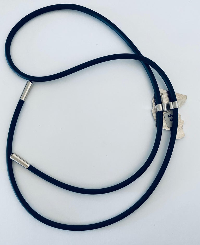 Worn like a bolo tie around the neck.
This is new old stock vintage Jewelry from the legendary Acme Studio collection, which created many revolutionary jewelry items.  It was handmade in the 1980s using the intricate cloisonné process, an ancient