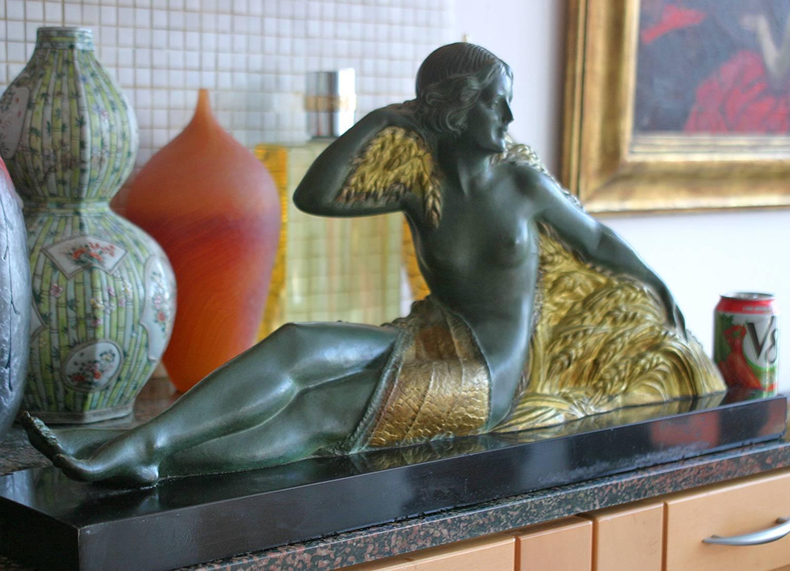 Beautiful  large work and it's very heavy.  Bronze with green and gold patina. It is very heavy 