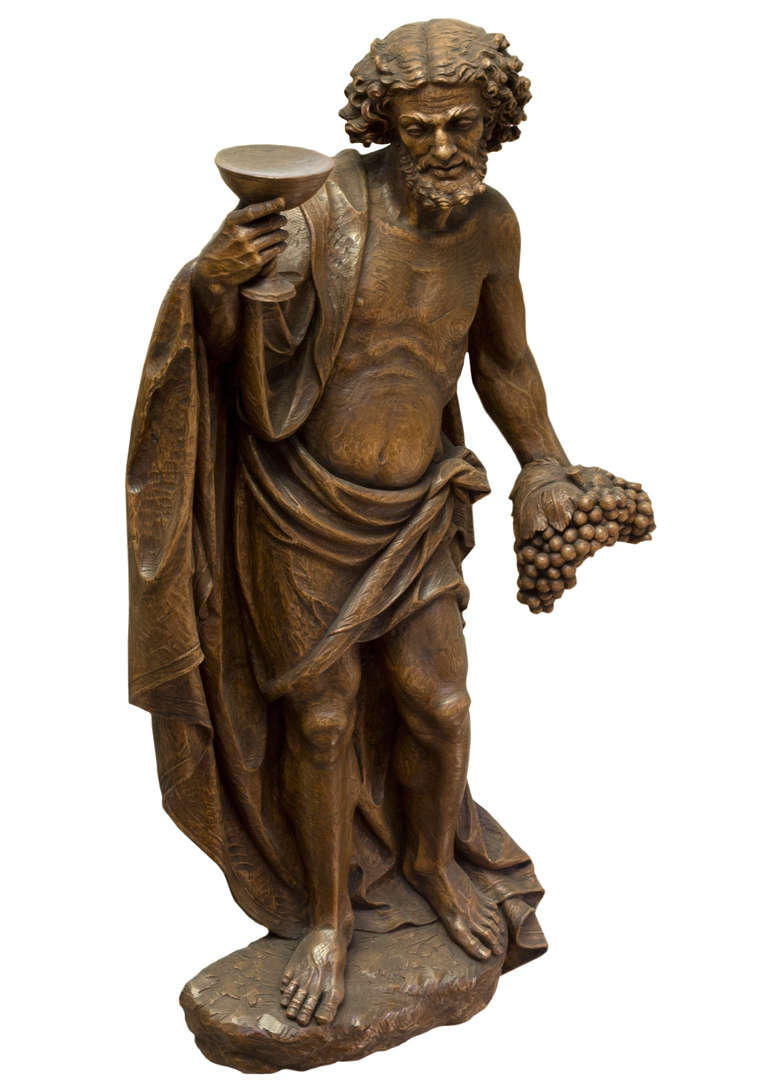 A monumental wood wall sculpture of Bacchus - Sculpture by Pietro Vinotti