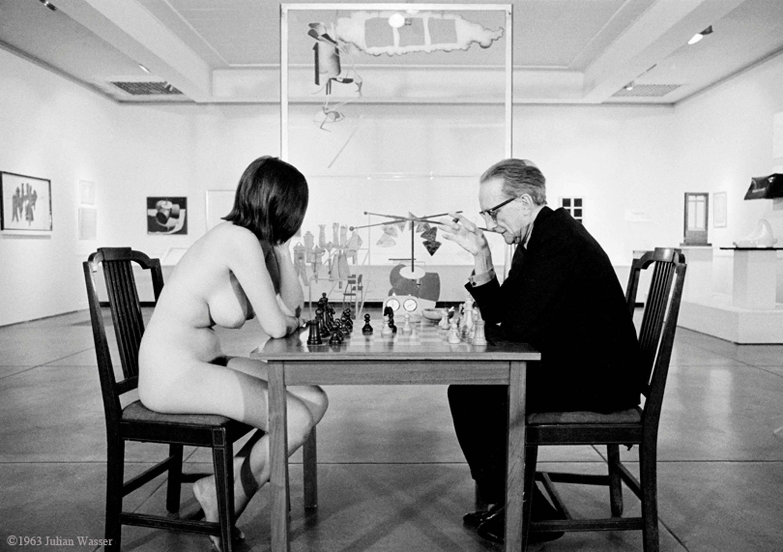 Julian Wasser Black and White Photograph - Marcel Duchamp Playing Chess with Eve Babitz, 1963