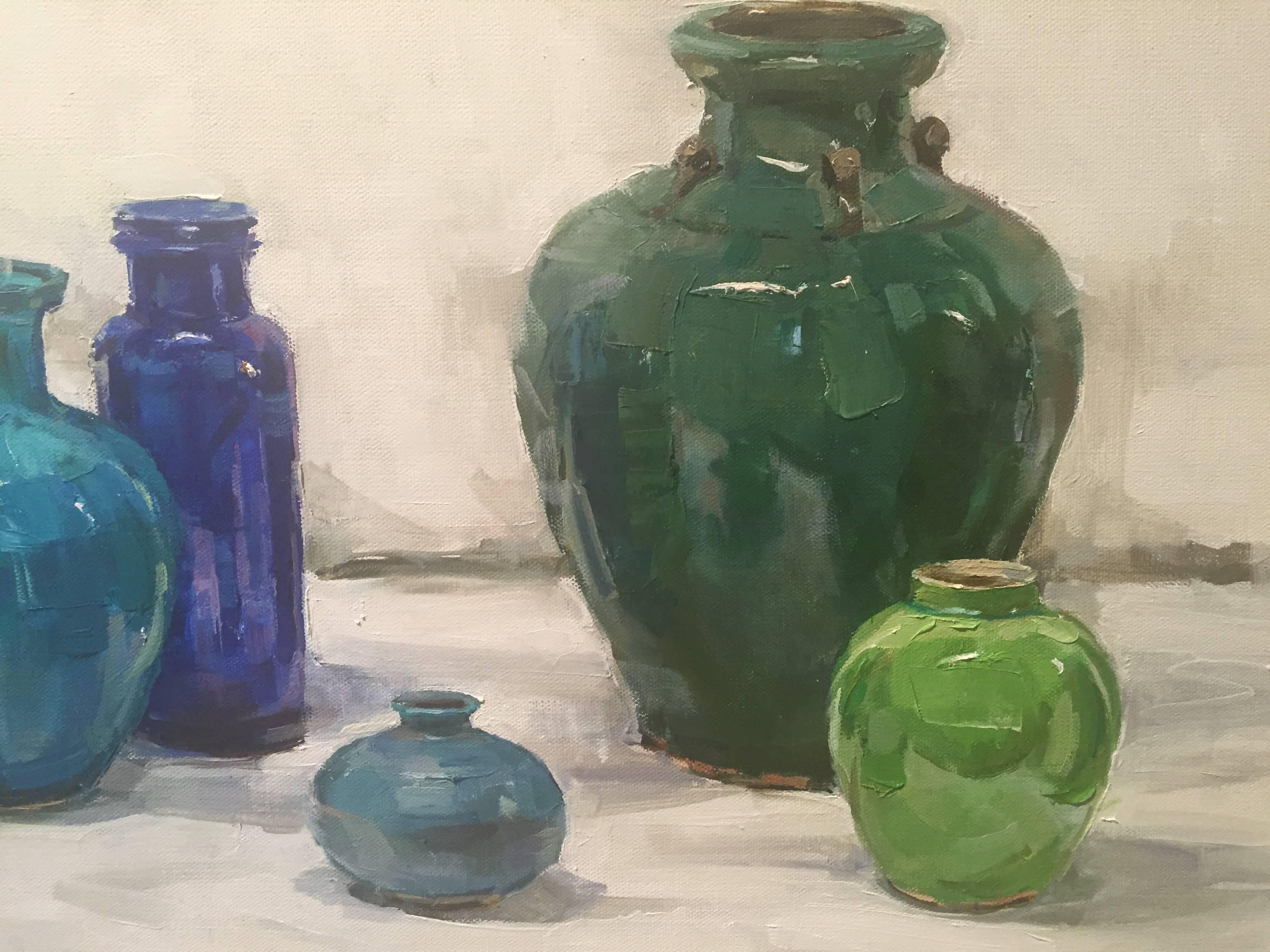 Painted from life, an array of vibrant cool jewel tone vessels placed on a pale bright backdrop.

A resident of East Hampton, New York, Beth Rundquist paints portraits, still lifes, figures and plein air landscapes. Its refreshing to see an