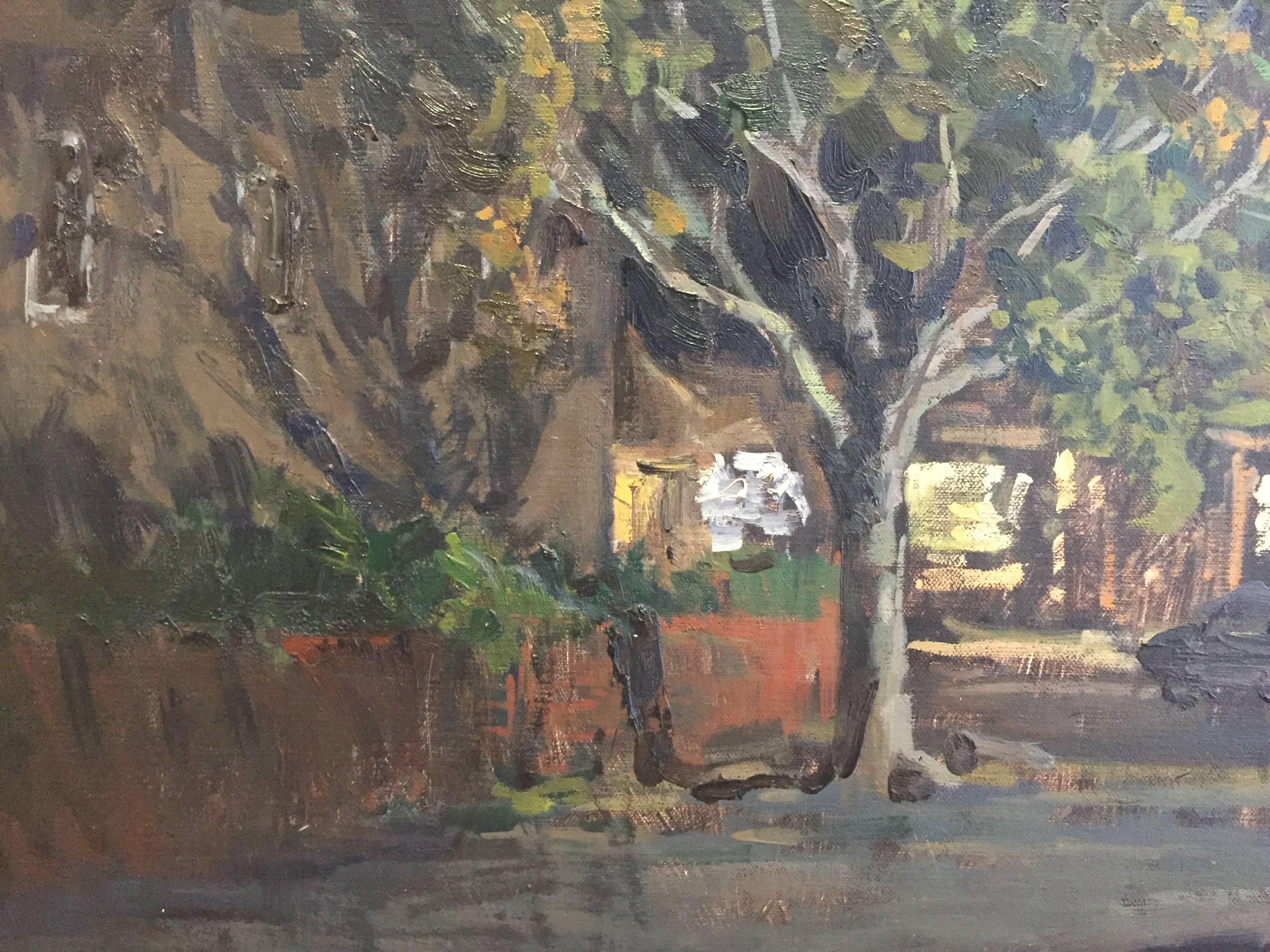 Painted en plein air, in Sag Harbor, New York. Situated in the People's United Bank parking lot, Butko looks over to the opposite side of Main Street. Beneath tall, fully bloomed trees, illuminated storefronts glisten after they close up for the