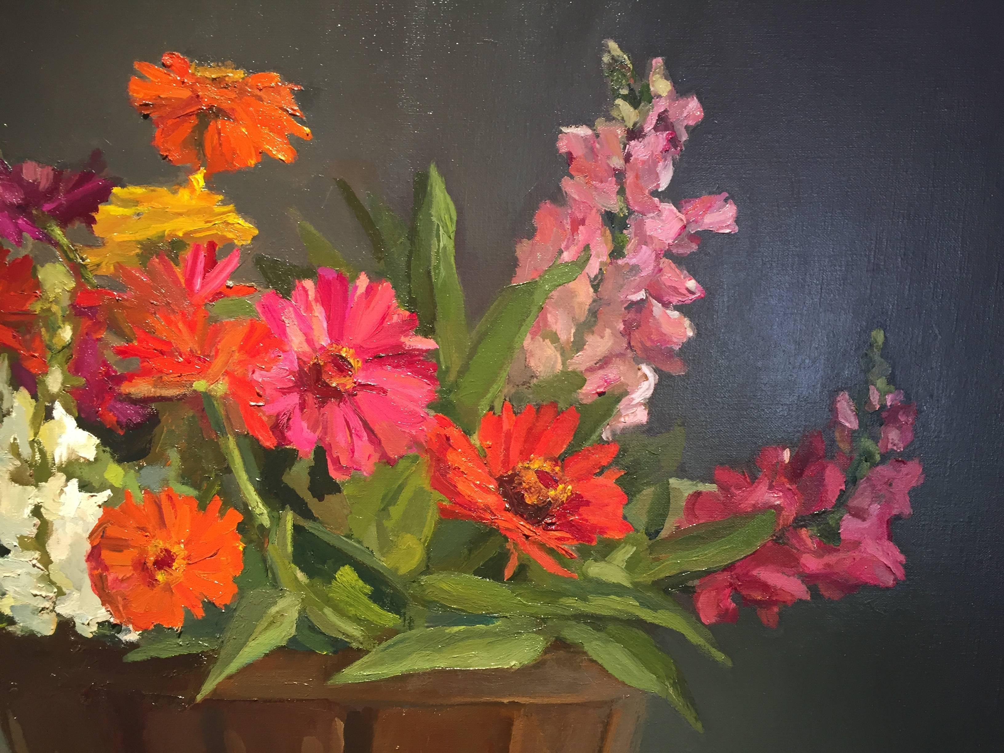 Painted from life in the artist's studio, a rustic, wooden basket overflows with bright colored flowers. Four apples scattered in the foreground, cast shadows, and reflect on the grounds surface. 

Maryann Lucas lives and works in Sag Harbor. She is
