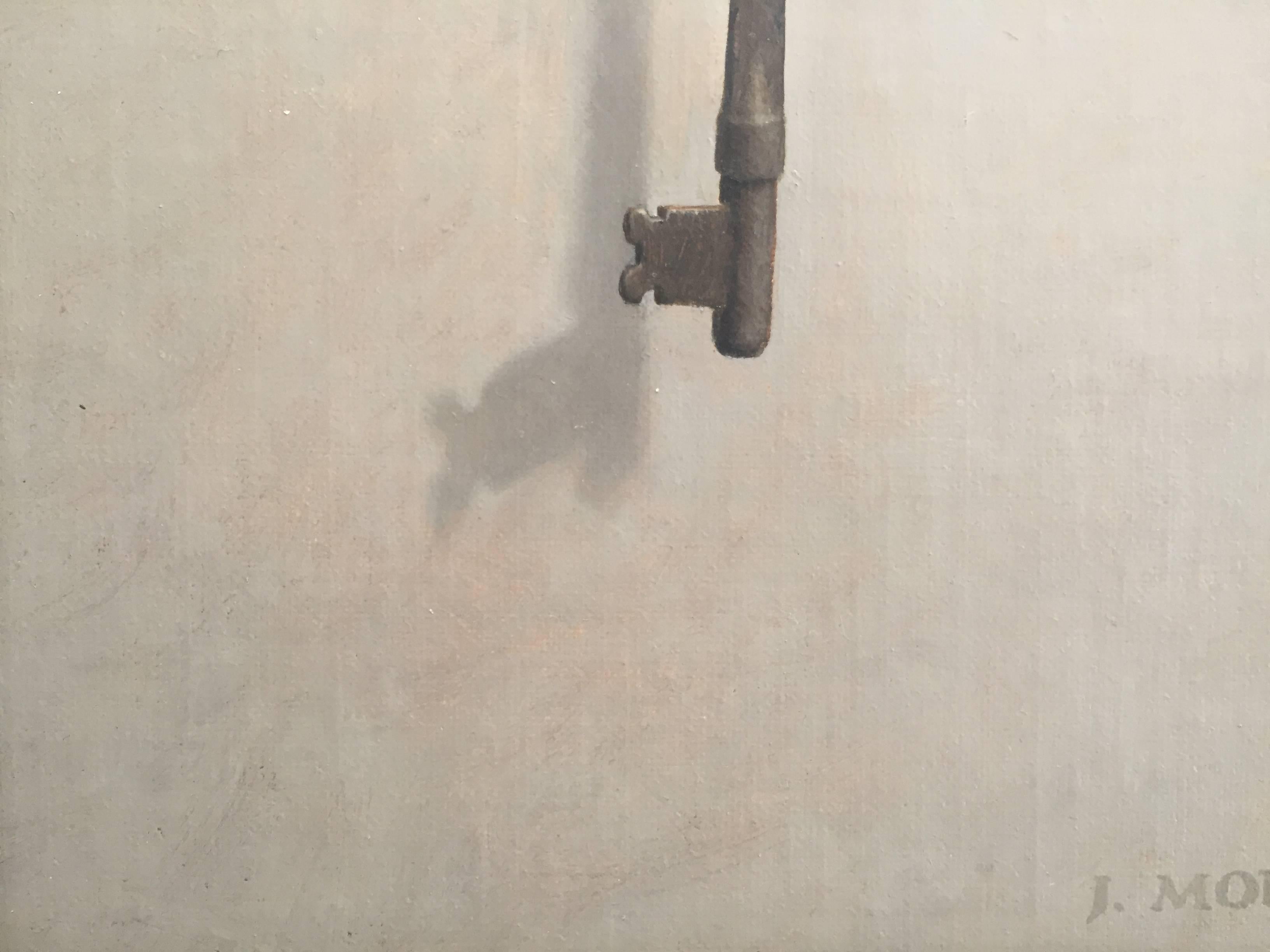 An old-fashioned barrel key hangs from a single nail on a grey wall. A shadow falls to the lower left, indicating the light source must come from the upper right. Morfis, painting in the style of 
