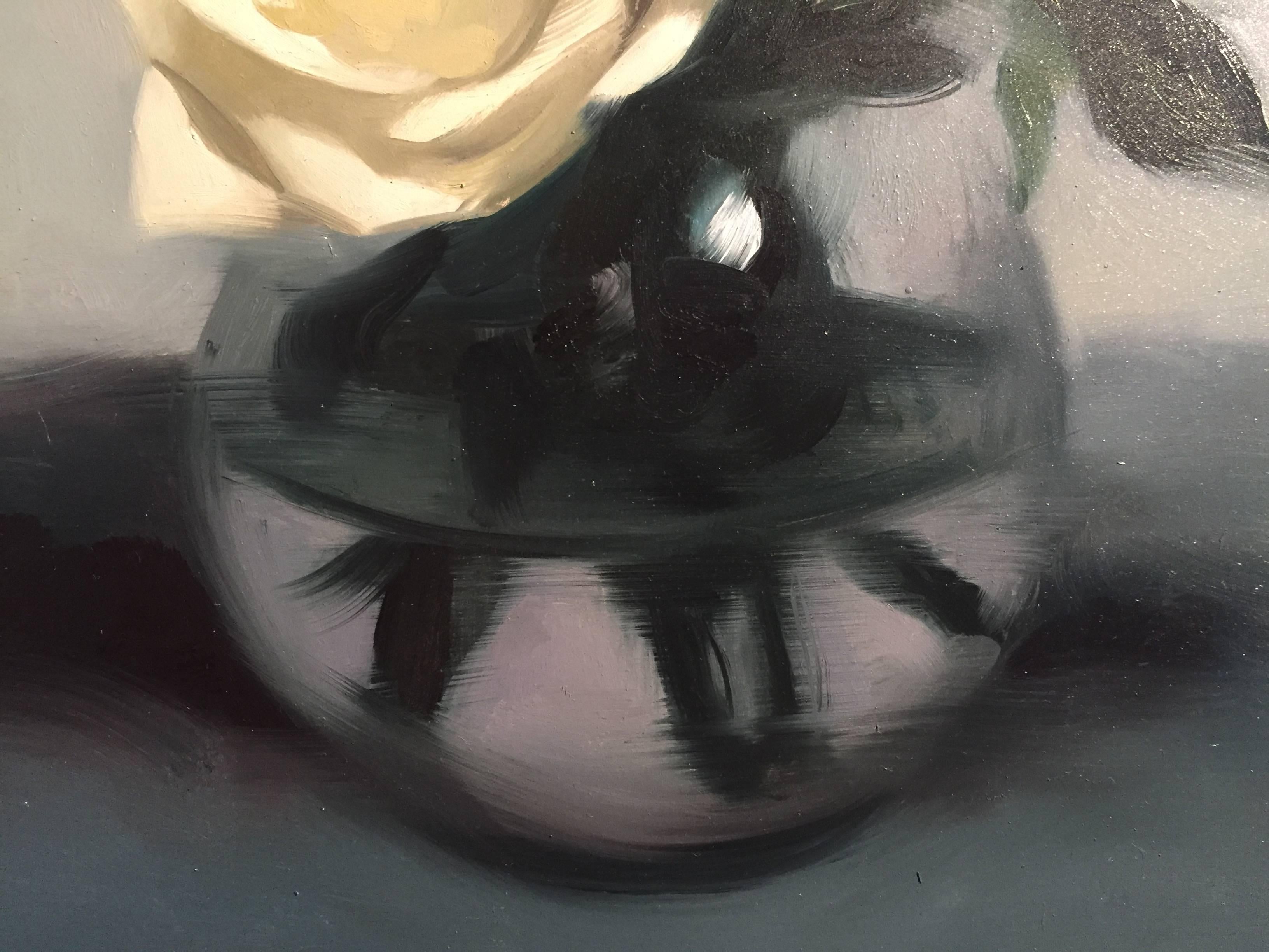 A still life painting of creamy white roses in full bloom, against a lavender, blue, background. Arranged in a bulbous round vase, which reflects light from above.

Born in Memphis, Tennessee in 1980 Bauman's family soon after that relocated to