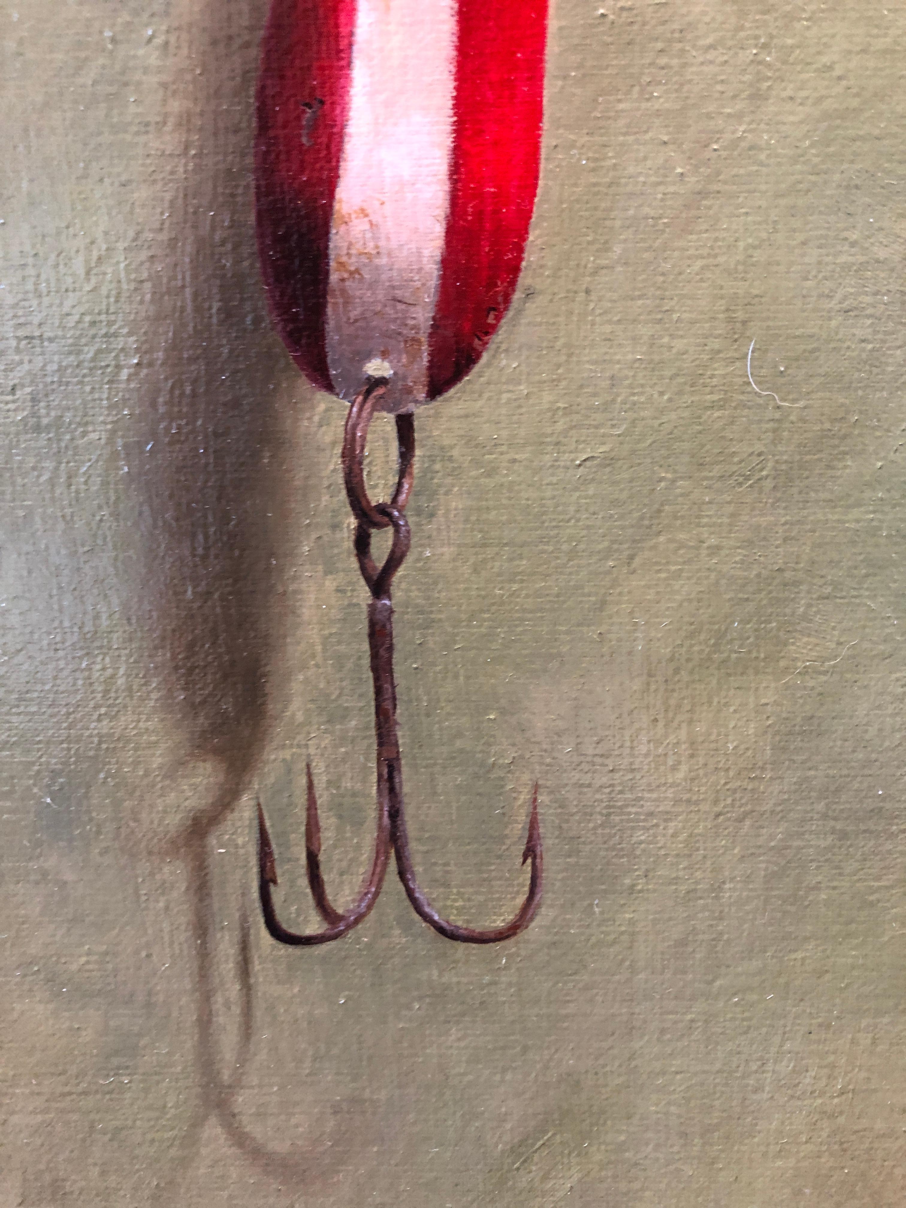 Painted from life, a fishing lure hangs delicately from a silver nail. 

John Morfis was born in Glen Cove, Long Island in 1976. His humble beginnings made pursuing a career in art difficult and paradoxically necessary. Fixated on making things