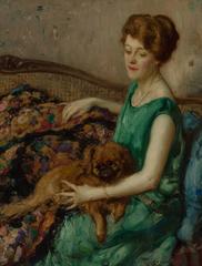 Lady in green with a dog on her lap