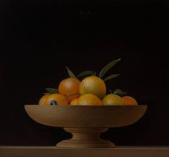 Tangerines in a wooden bowl