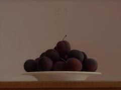 Plums on a writing desk