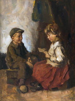Two children reading from a book