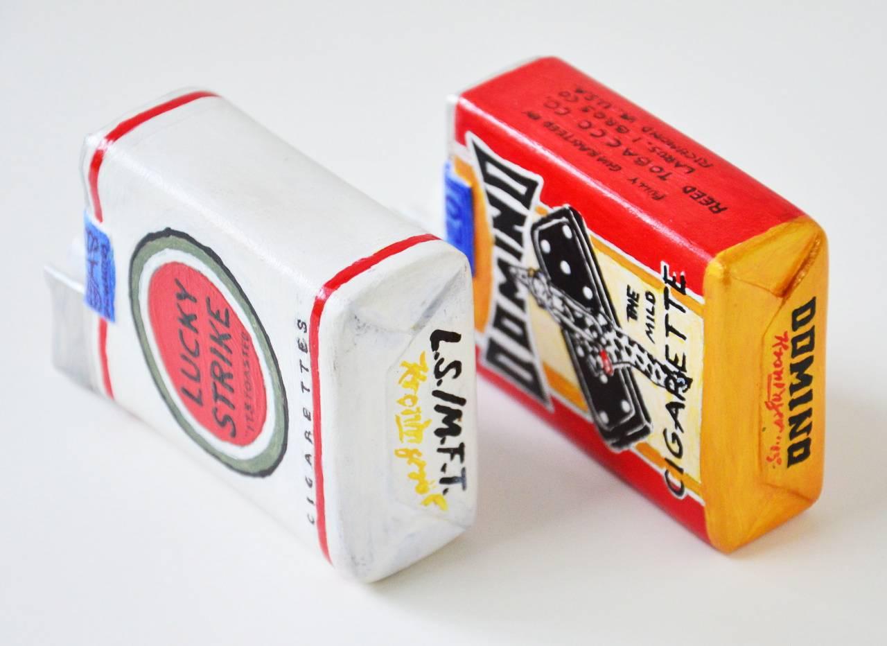 Pack of Smokes, Lucky Strike and Domino - Sculpture by Rick Kroninger