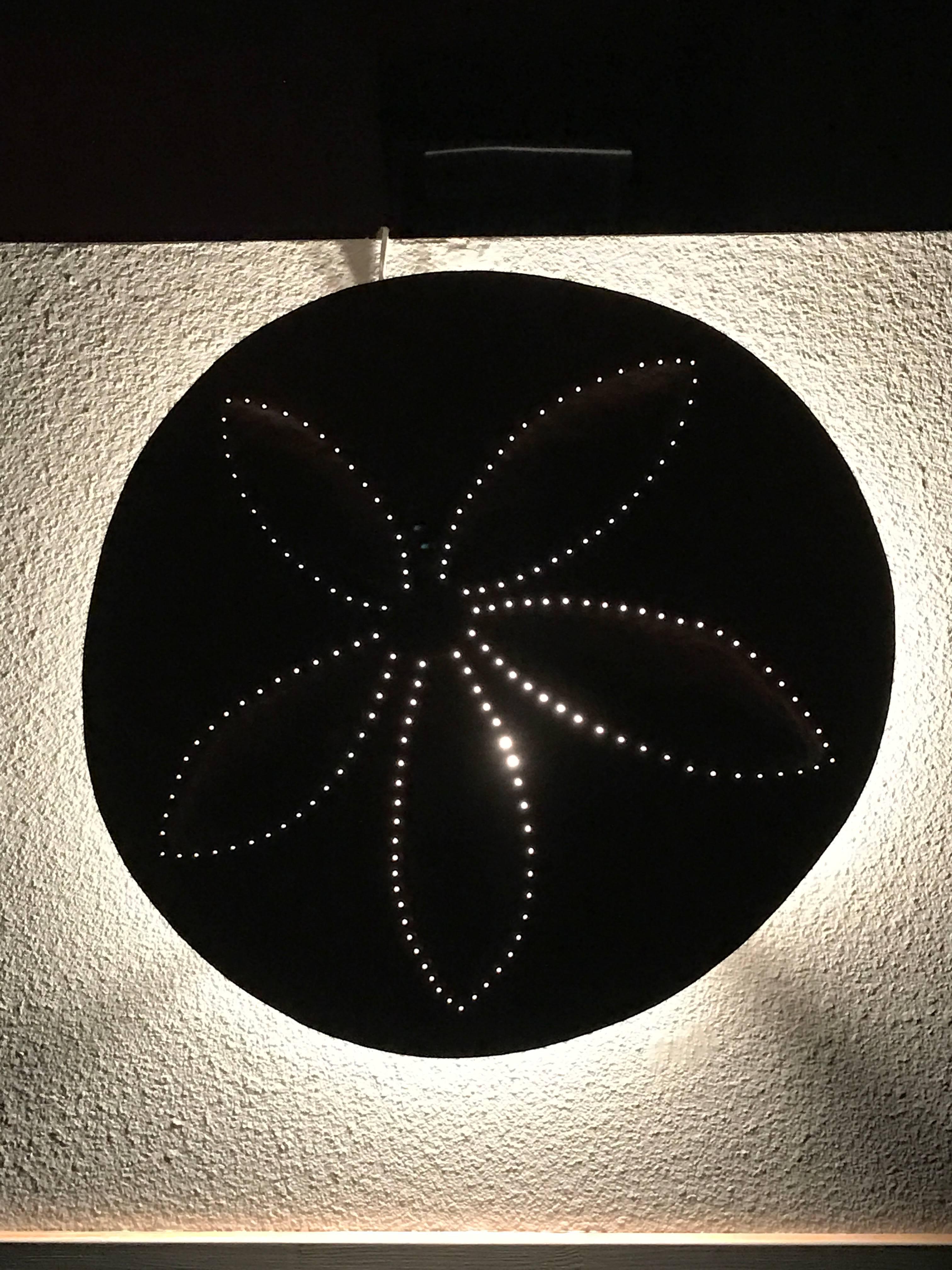 hand forged metal illuminated wall sculpture. Signed and powder coated.

Laura Walters Abrams has been making sculpture since the early 1990’s. Her success is due to her ability to not only create beautiful and meaningful art, but effortlessly