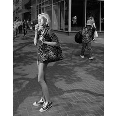 Here, on the street, perhaps waiting for a friend 4
