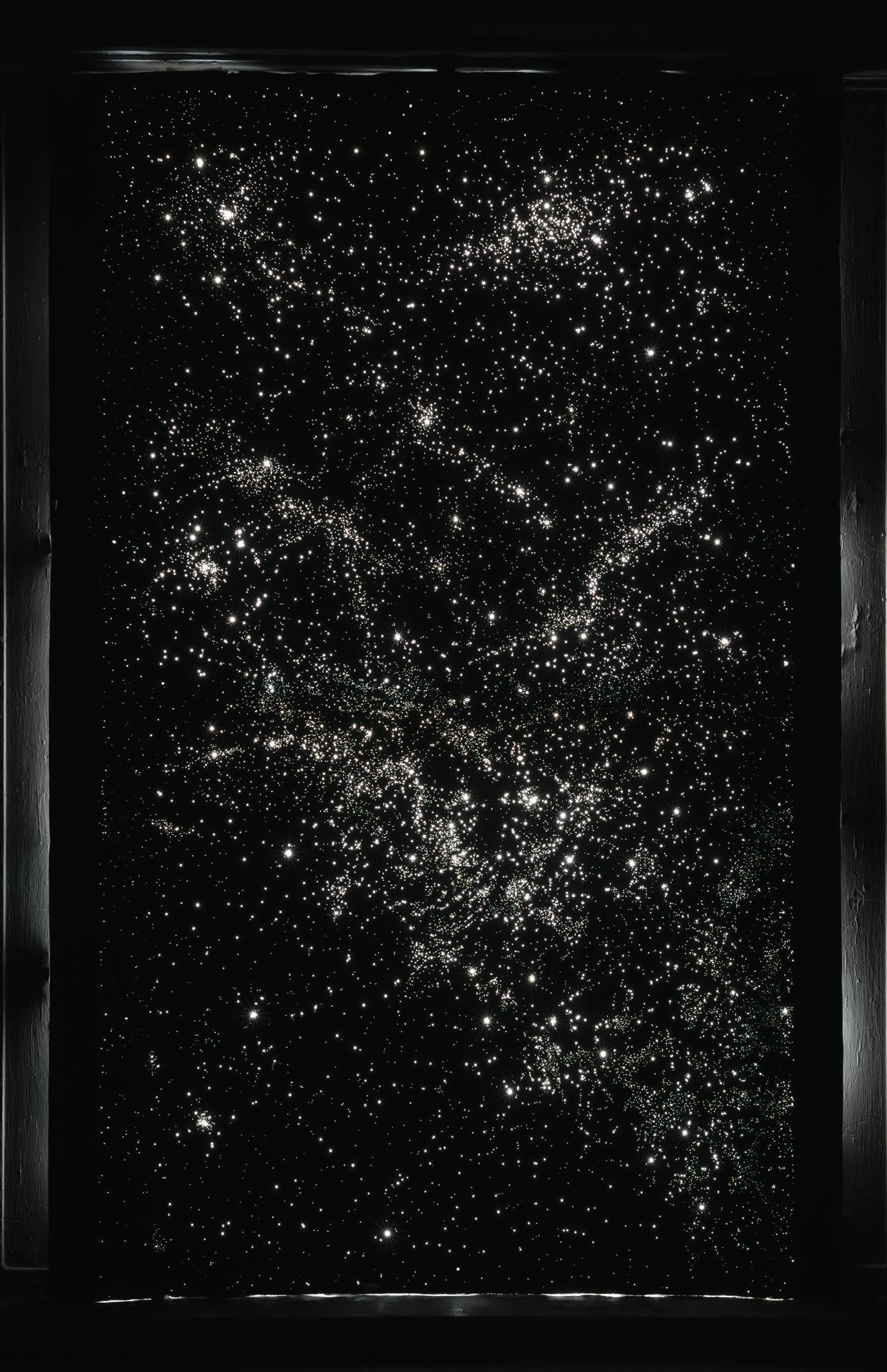 In Night and Day, Julia Randall uses pin-pricked black photography paper to reproduce the alignment of the cosmos viewed from a window at the moment of a deep personal experience. The is set into the small window, daylight illuminating the page from