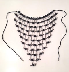 Tamiko Kawata, Lacy Bib Necklace, steel safety pin, wood bead, and cord, 1999