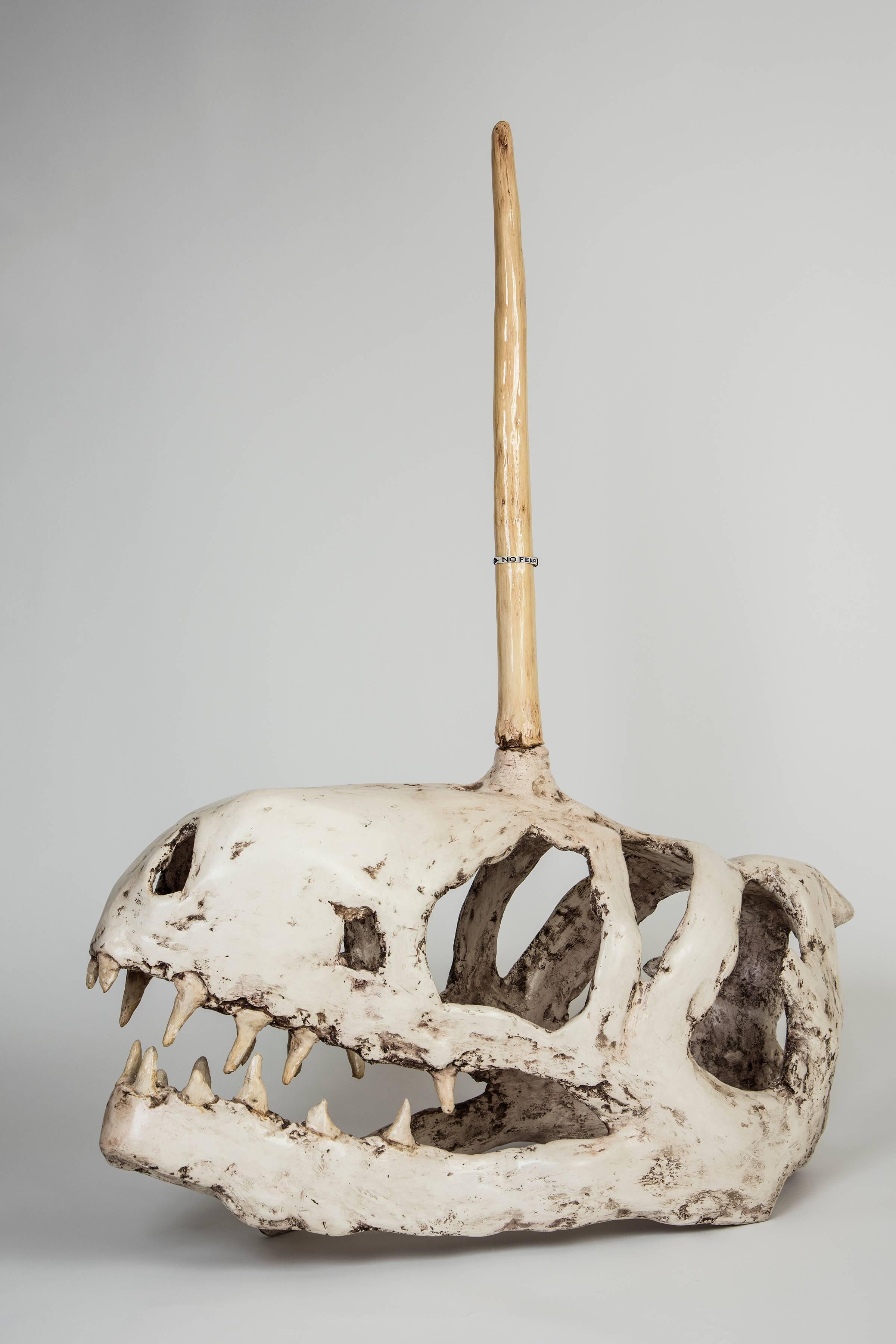 Joshua Goode Figurative Sculpture - Adolescent Unicorn T-Rex Skull with 'No Fear' Bedazzlement