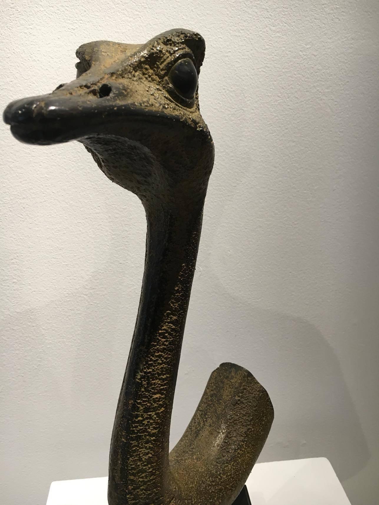 This modern contemporary bronze casting of an ostrich head is simple in its composition, but detailed in every aspect of its rendition.

French sculptor Quentin Garel received 5 prestigious awards for drawing and sculpting between 2001 and 2005 from