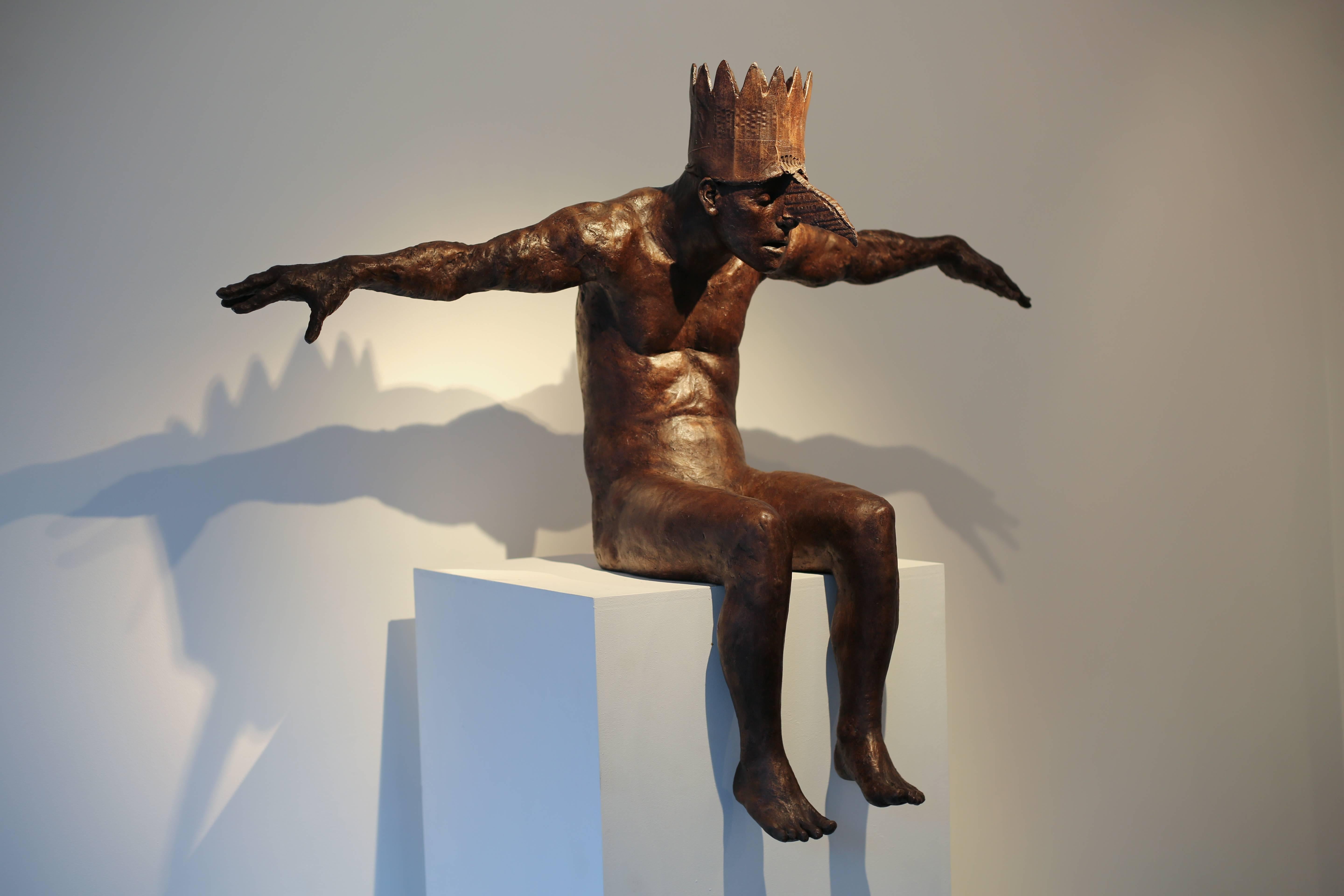 This modern contemporary figurative sculpture, is a bronze casting of human figure with crown with a fantasy quality. The arms are spread like wings with a human head and bird beak, slouched and seated, forward reaching posture.

Anyone who shares