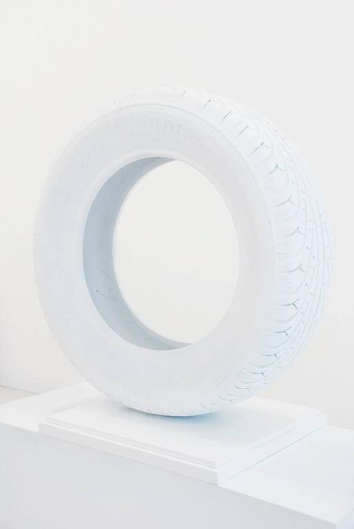 Sculpture made from a tire, rubber and velvet with dimensions of 31" H x 32" W x 8" D.