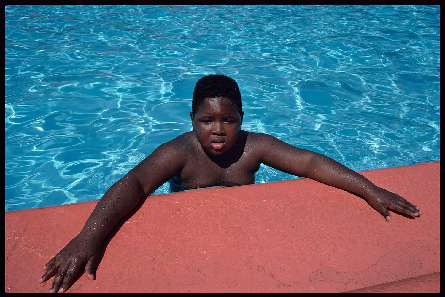 Joseph Rodriguez Color Photograph - Boy in Pool, Spanish Harlem, NY