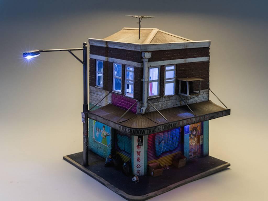 Joshua Smith Still-Life Sculpture - Black Shadow Trading cie - miniature light up building with graffiti street art