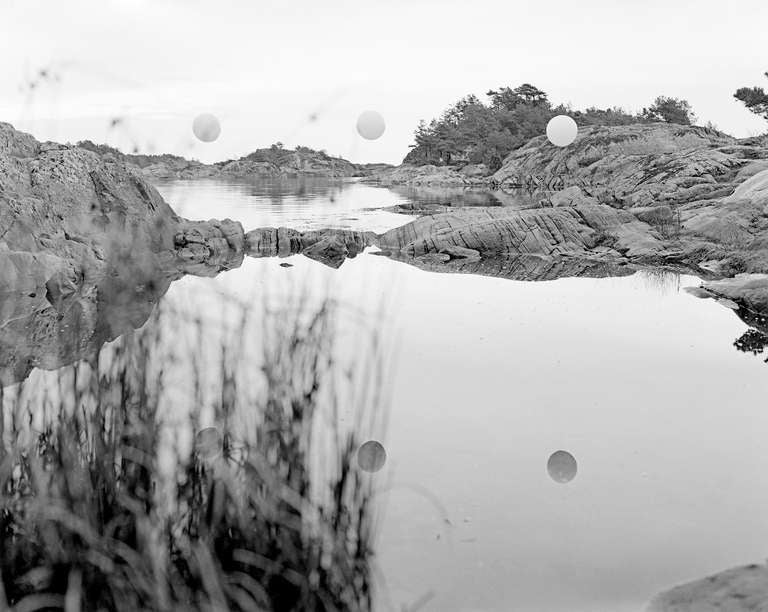 Ole Brodersen Landscape Photograph - Rubber string and rocks #01 - black and white contemporary landscape photo water