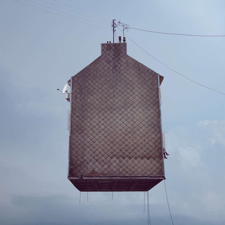 Laurent Chéhere, a French photographer born in 1972 in Paris, makes images of flying houses and other dwellings that are informed by his wanderings in the hidden neighborhoods of Paris and by his love of cinematic history.  Most of his photographs