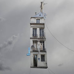 Max -whimsical grey color photography of a Parisian hotel flying house