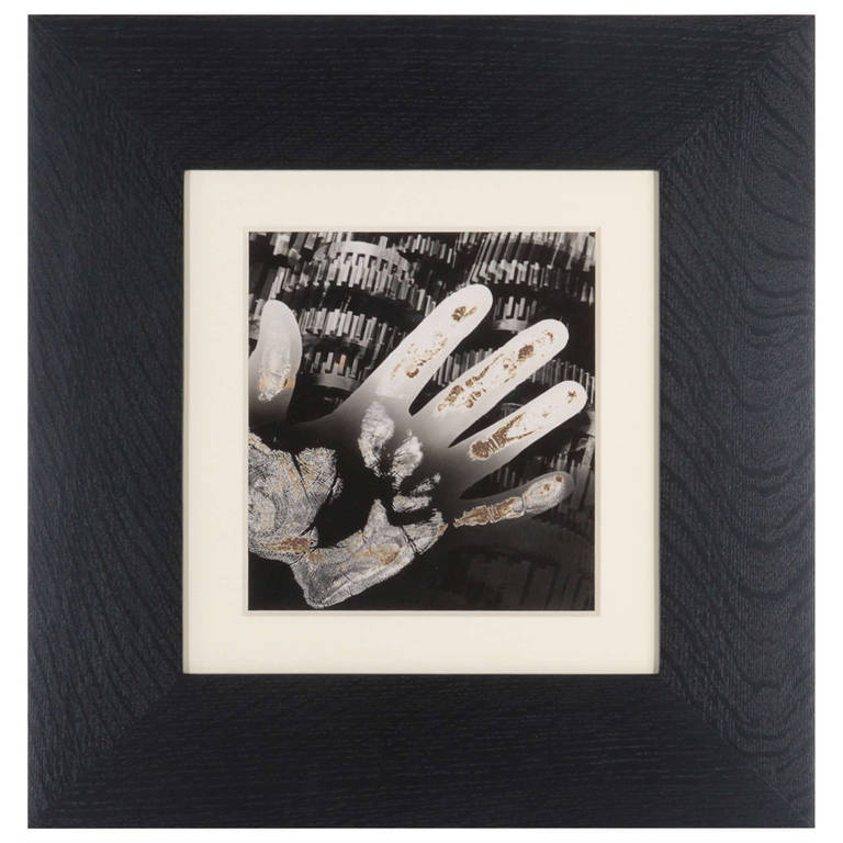 Edmund Kesting Black and White Photograph - Gears with hand - Photogram / Solarization