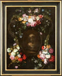 Swags of flowers adorning a grisaille cartouche with a bust of a girl