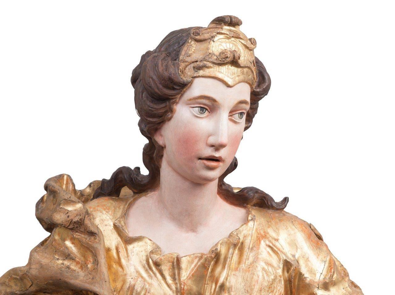 These two sculptures date from the 17th century and they are an beautiful example of baroque art. 
Both figures are nearly lifesize and have an impressive and highly decorative character. The sculptures are carved and polychrome and gilding can be